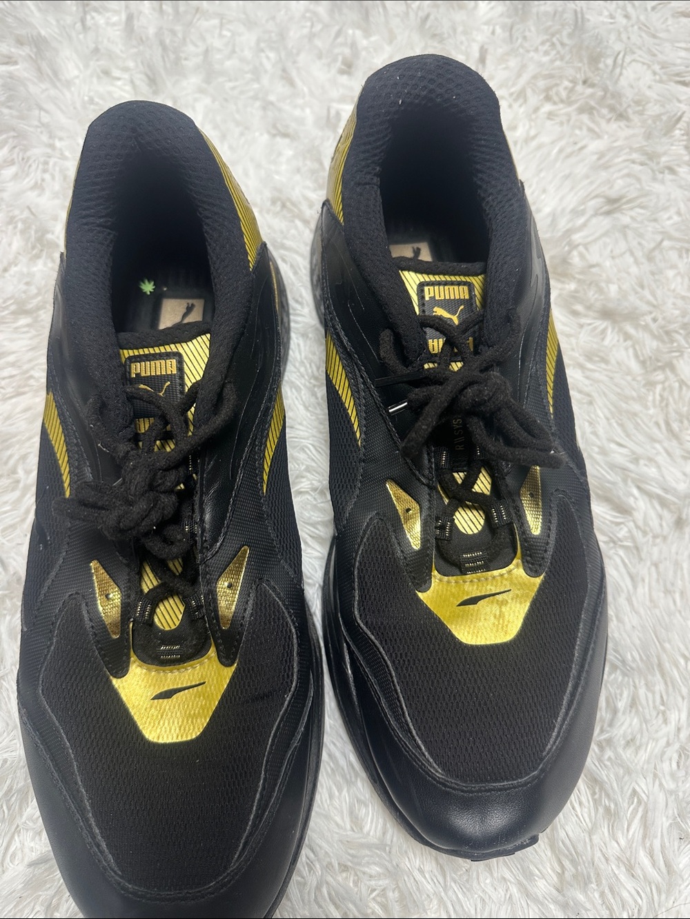 Puma Men’s Black and Gold Athletic Sneakers